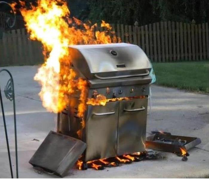 Image of a grill on fire