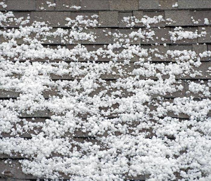 Image of hail on the roof of a home
