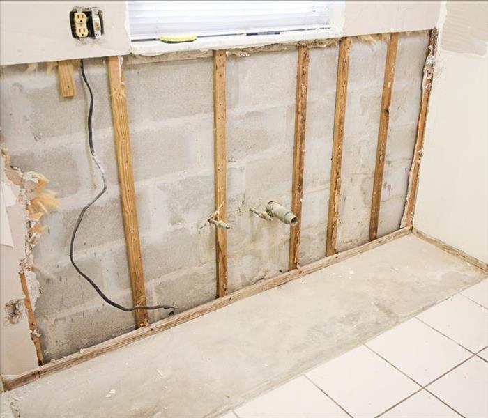 Image of a wall with flood cuts after suffering water damage
