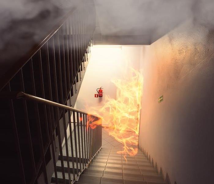 Fire coming up a dark stairwell