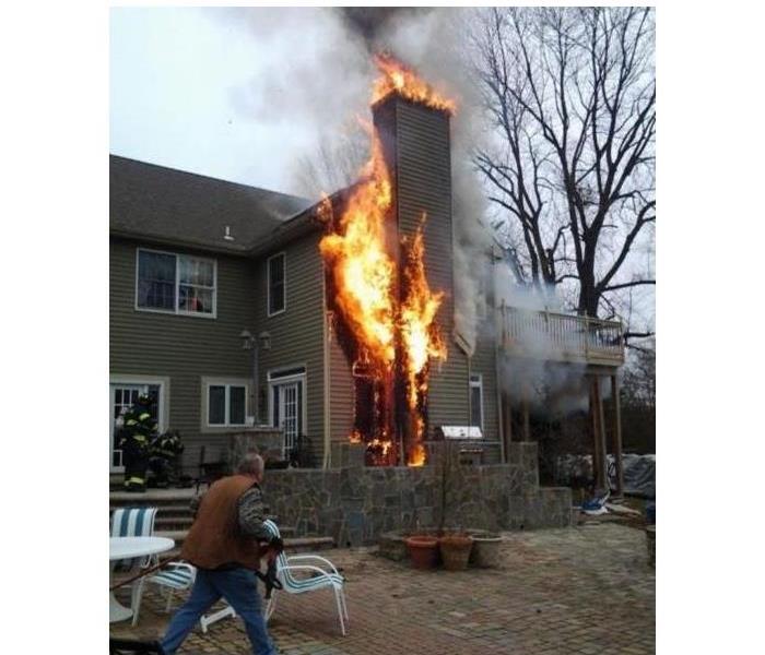 A house with a chimney fire